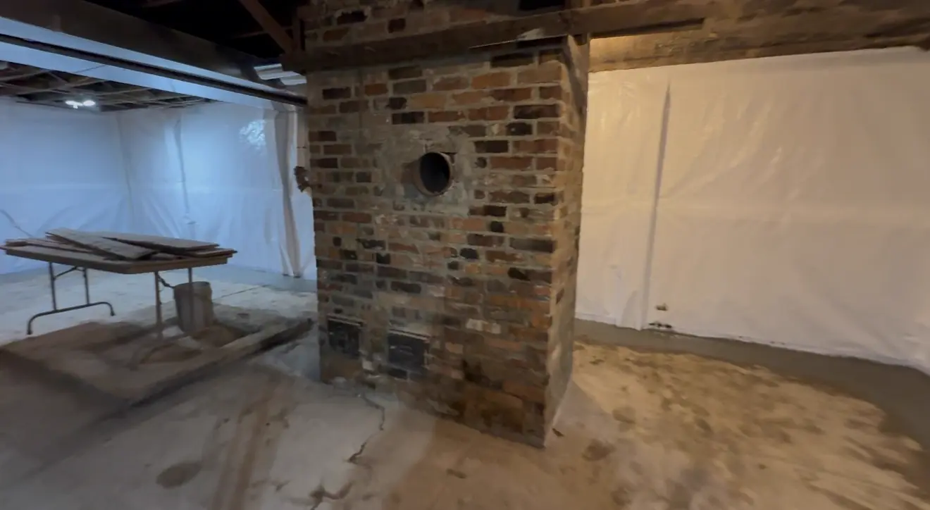 Completed interior drain tile channel with fresh concrete — Liberty, MO