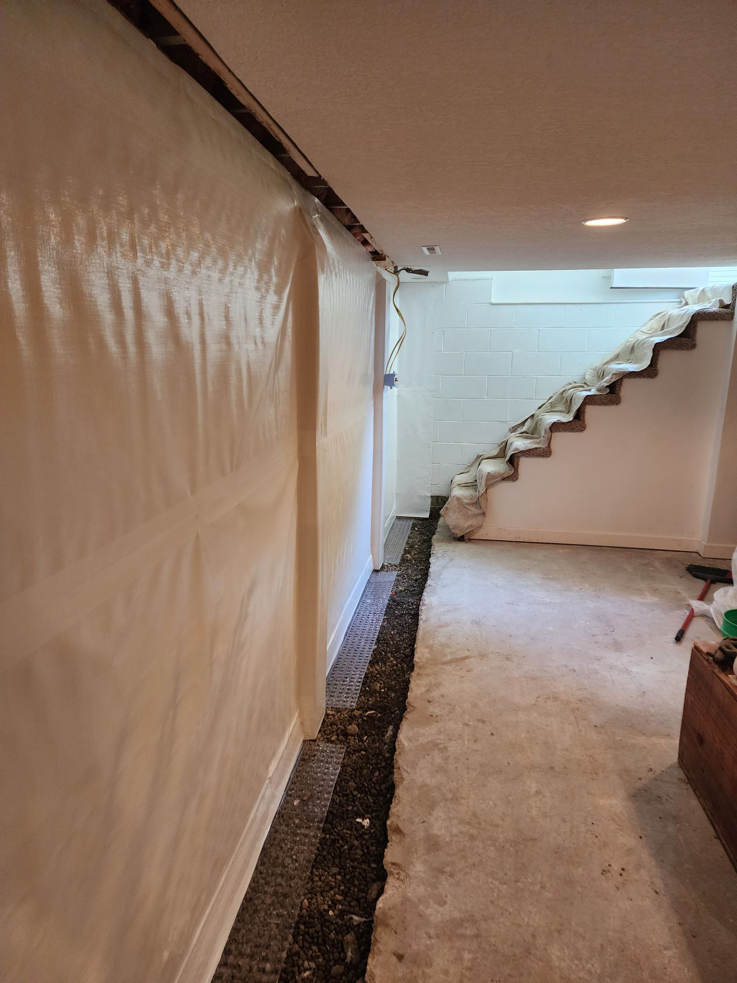 Vapor barrier membrane installed on basement walls with drain channel — Overland Park, KS