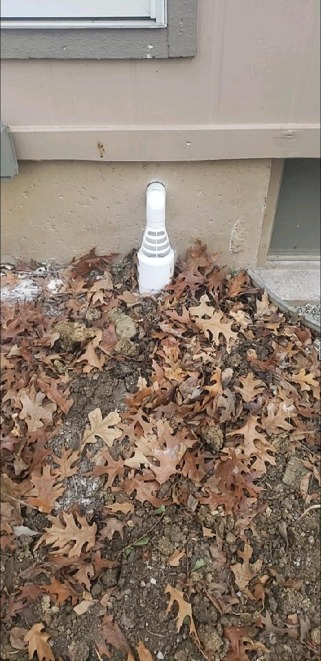 Sump pump discharge point too close to foundation — Shawnee, KS