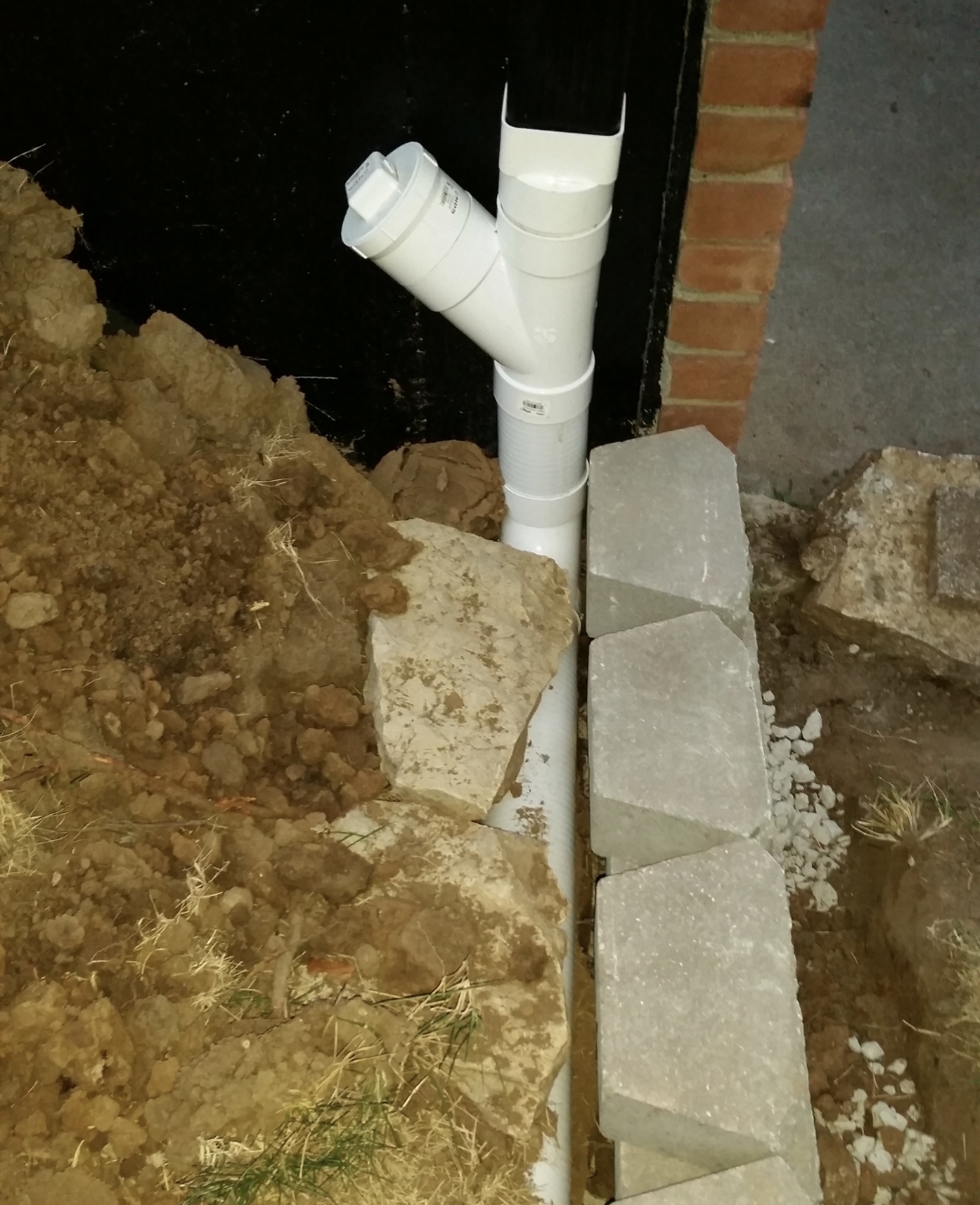 Drain pipe Y-connection installed at footing level — Olathe, KS