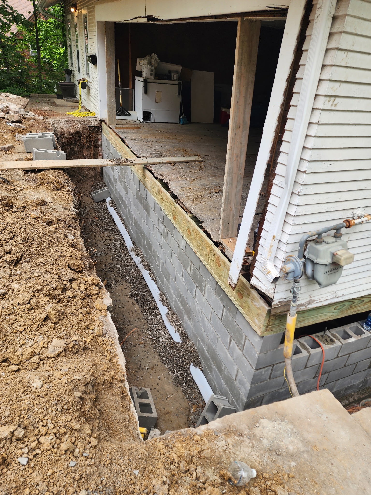 New CMU block wall construction rising from footing — Raytown, MO