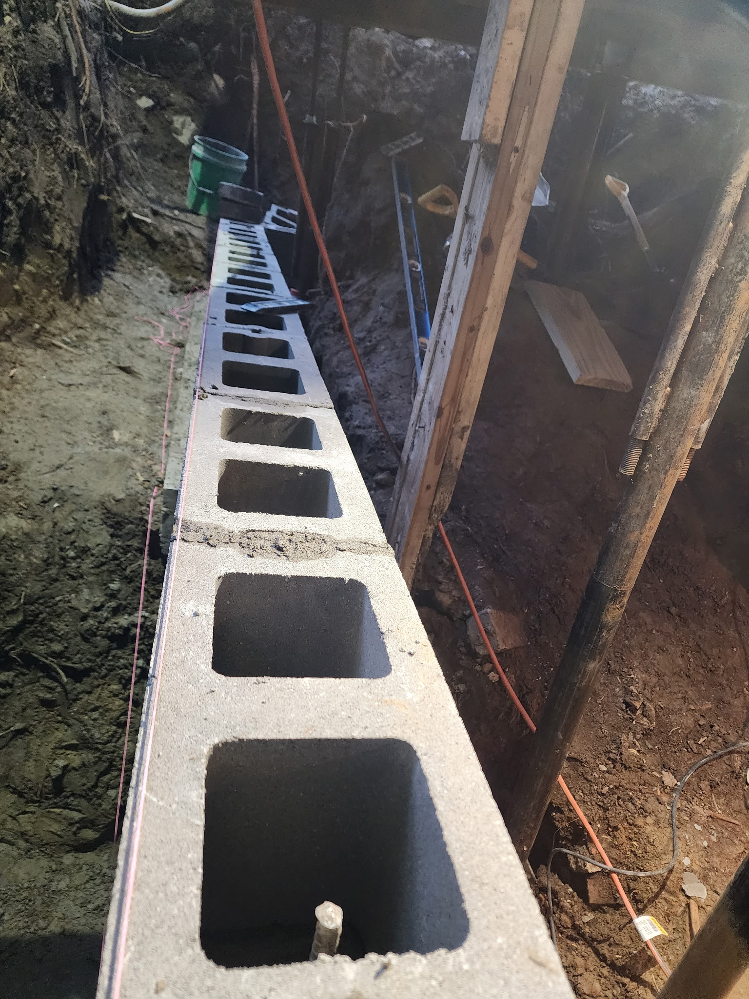 CMU blocks being laid in excavated trench — Raytown, MO