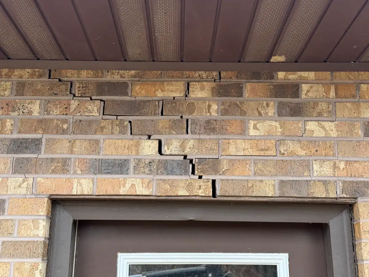 Vertical crack running along foundation wall near garage door — Grandview, MO