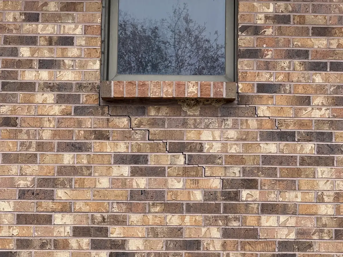 Window frame pulling away from wall due to foundation settlement — Grandview, MO