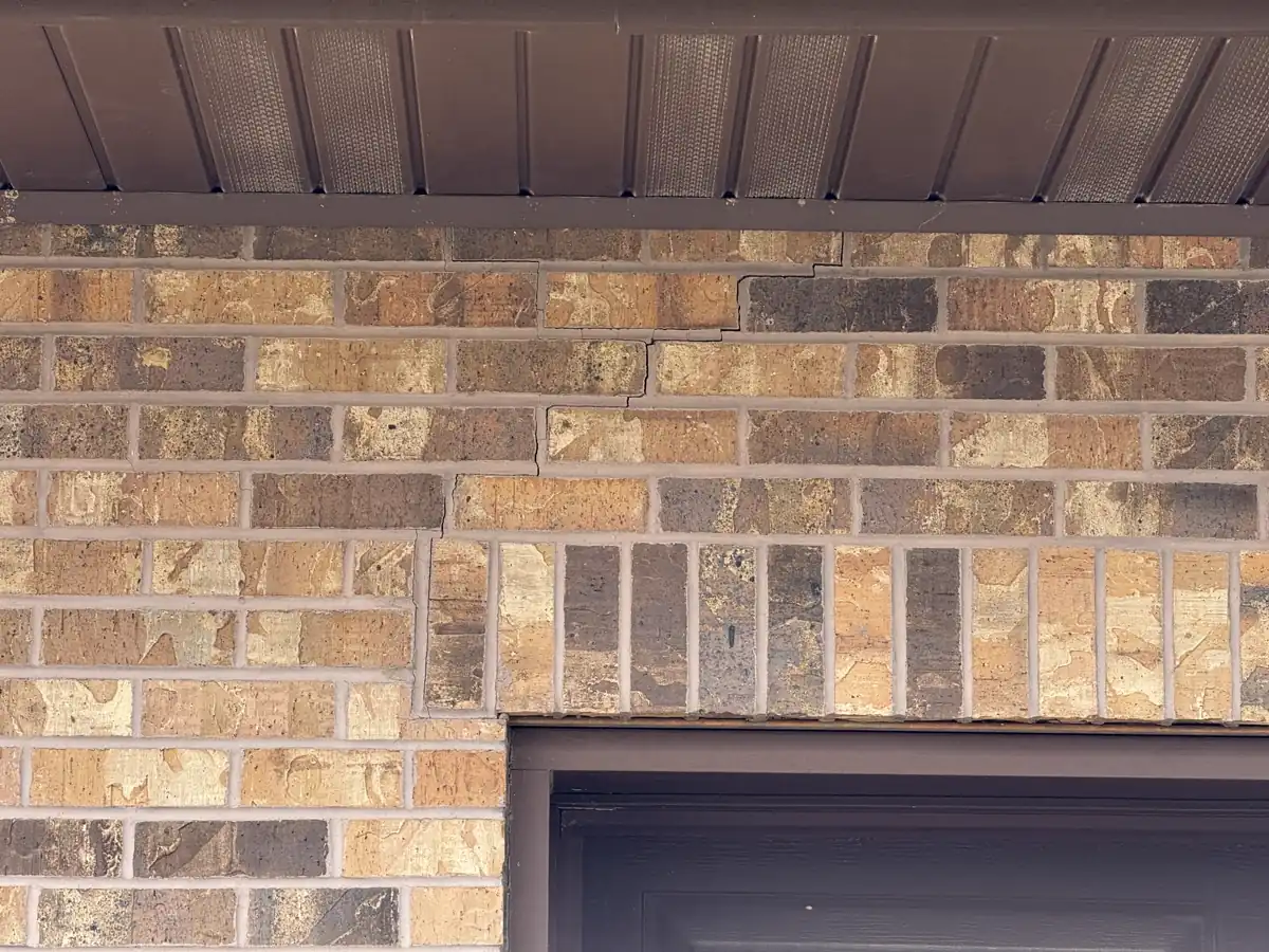 Garage foundation wall after push pier lift and stabilization — Grandview, MO