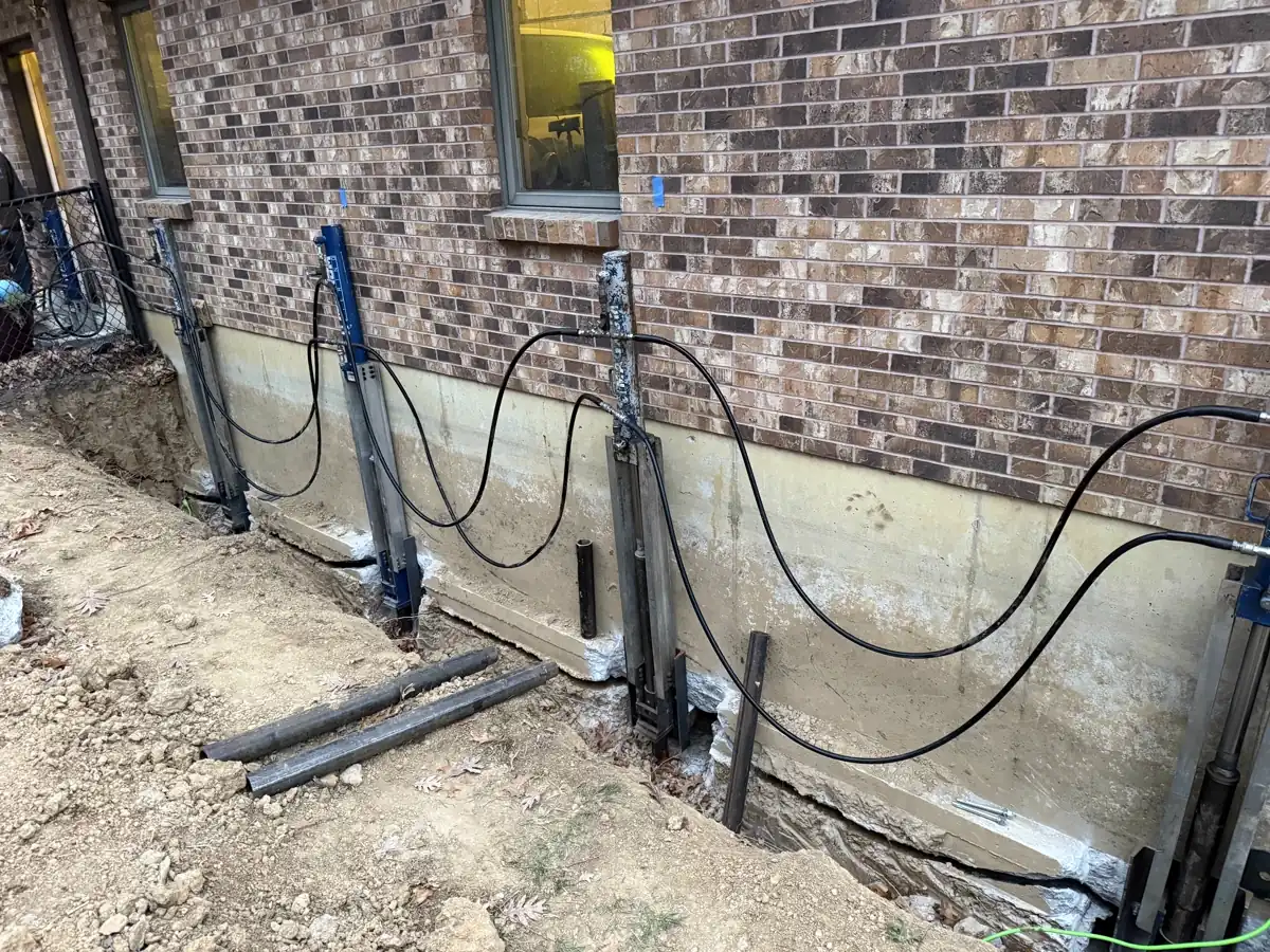 Row of push piers installed along full perimeter of home — Grandview, Missouri