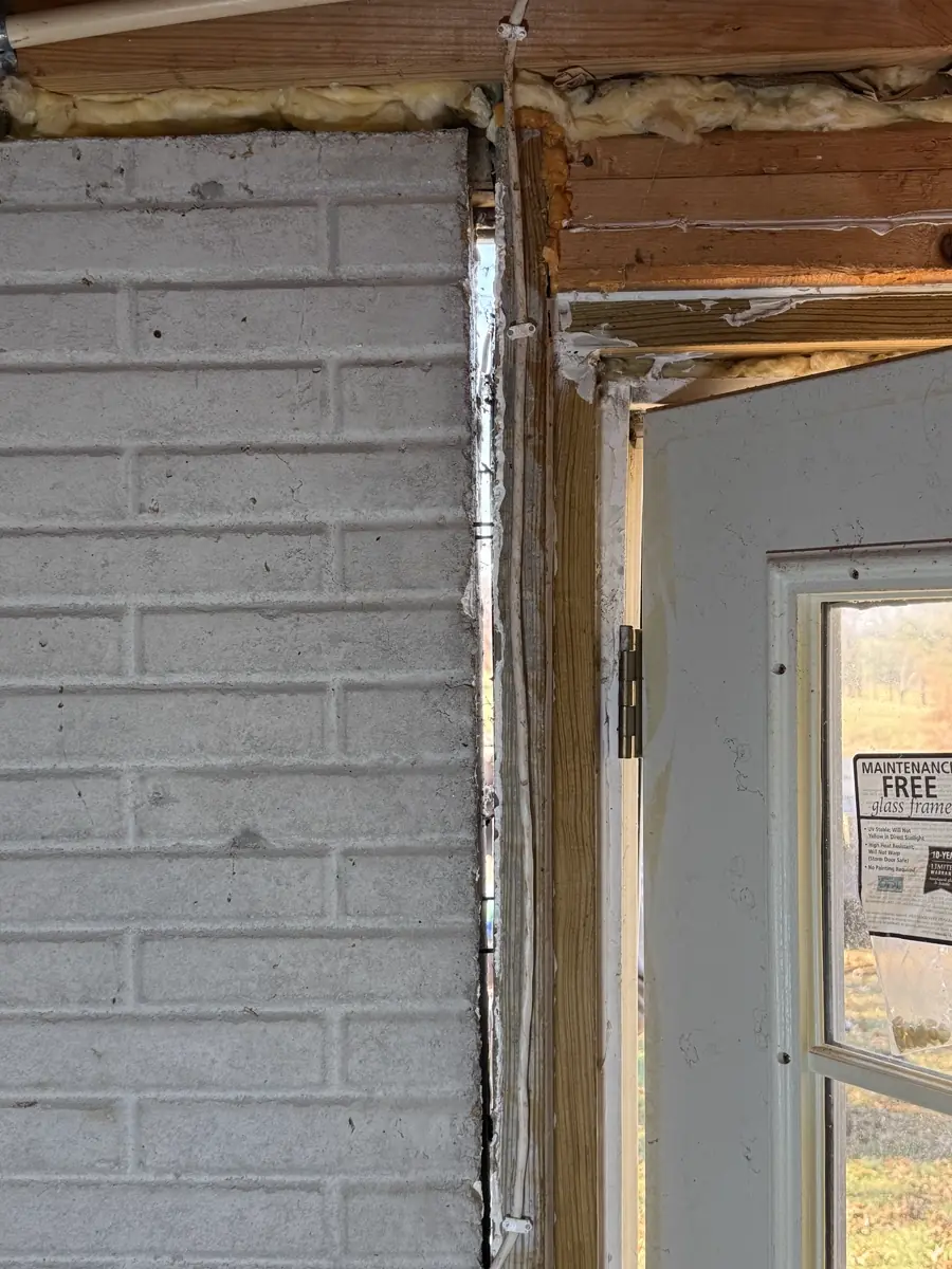 Steel pier bracket bolted to foundation footing — Independence, Missouri