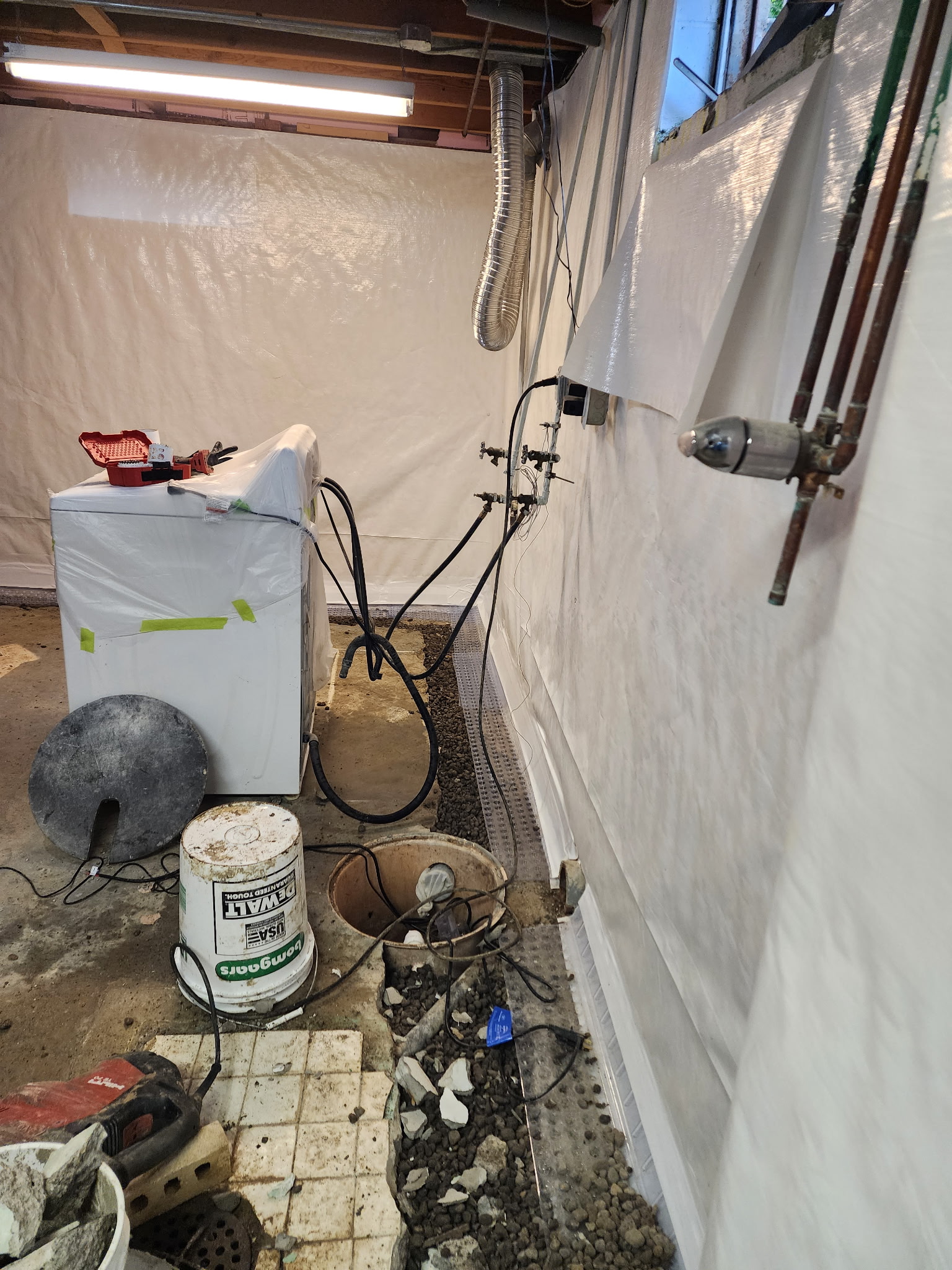 Interior vapor barrier and drain tile system installed — Lenexa, KS