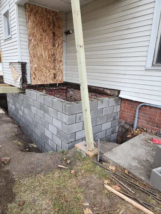 Excavated trench alongside old brick foundation — Ankeny, Iowa