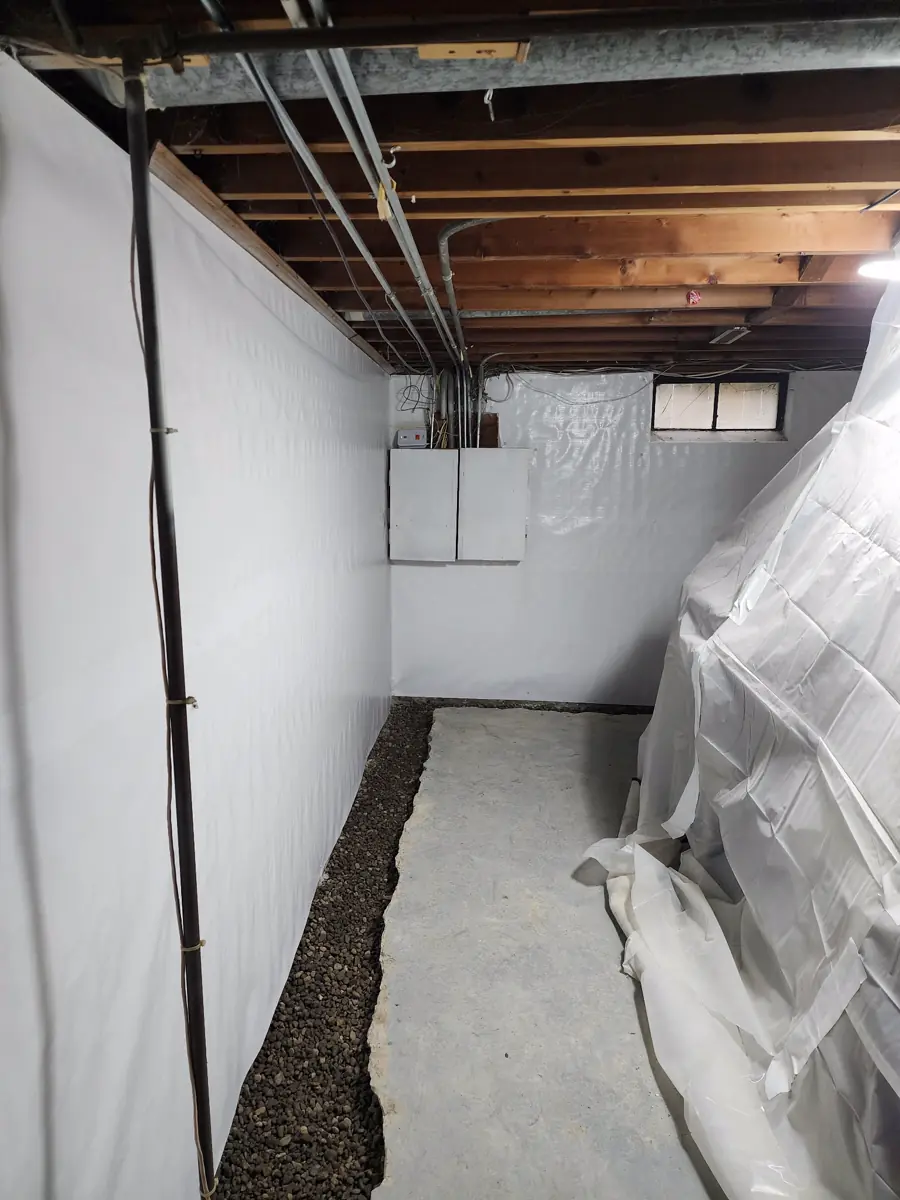 House framing temporarily supported above new foundation work — Ankeny, Iowa