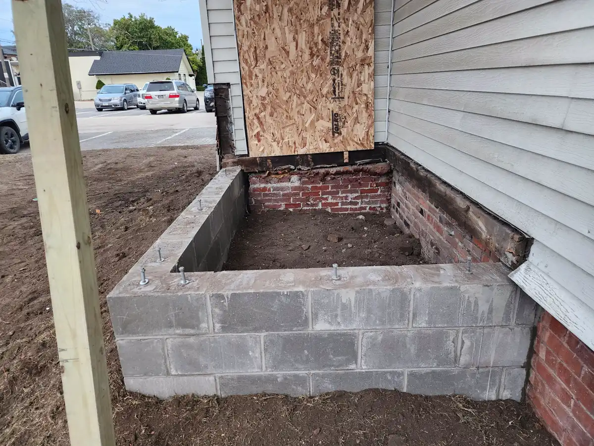 Freshly poured concrete wall curing with forms in place — Ankeny, Iowa