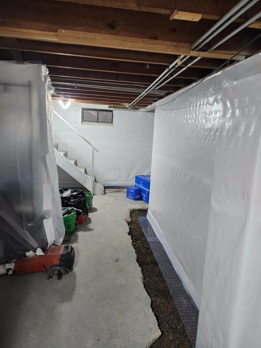 Backfill and grading around completed wall replacement — Ankeny, Iowa