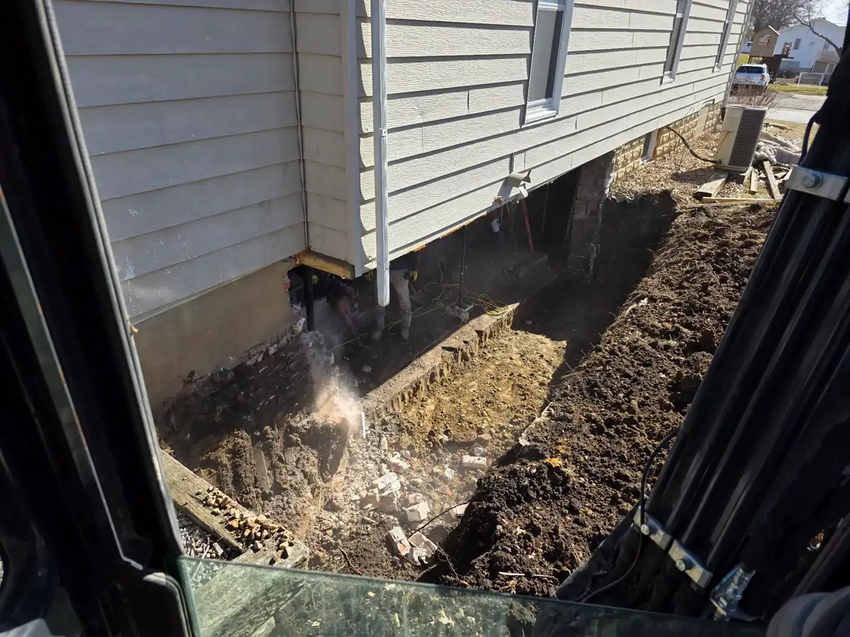 Severely deteriorated foundation wall exposed during excavation — Kearney, MO
