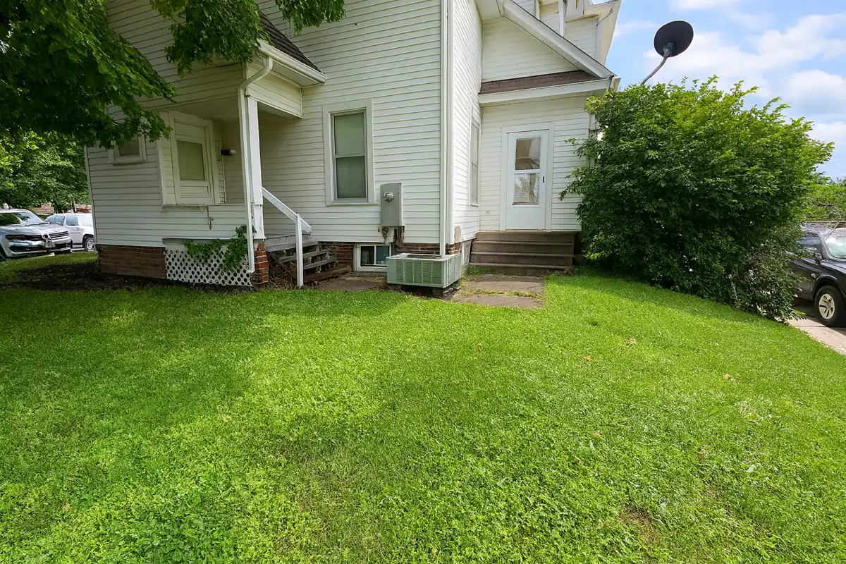 Completed wall replacement with restored grade — Urbandale, Iowa