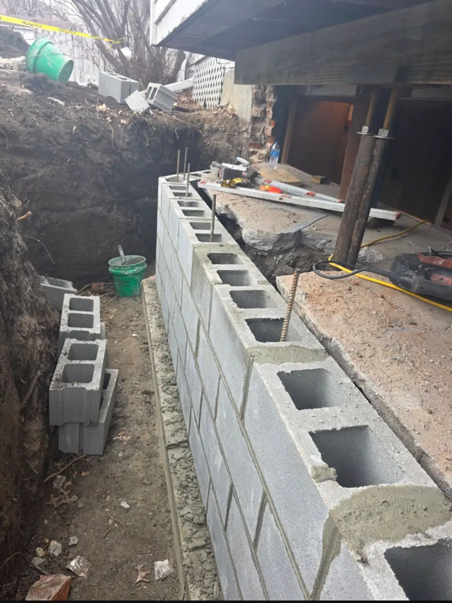 Finished wall replacement with restored exterior grade — West Des Moines, IA