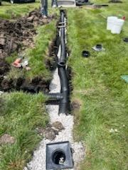 Drain pipe with catch basins installed in yard — Urbandale, IA