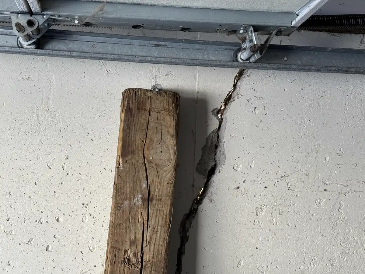 Cracked and peeling plaster caused by wall pressure — Lee's Summit, Missouri