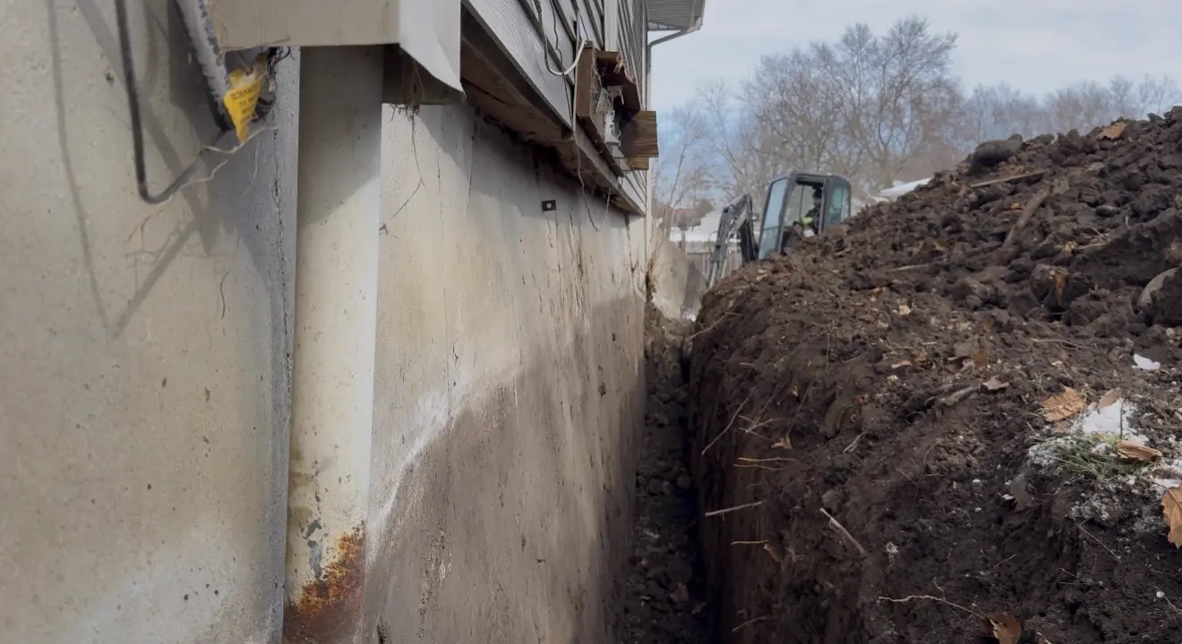 Wall anchor being installed through foundation — Raytown, MO