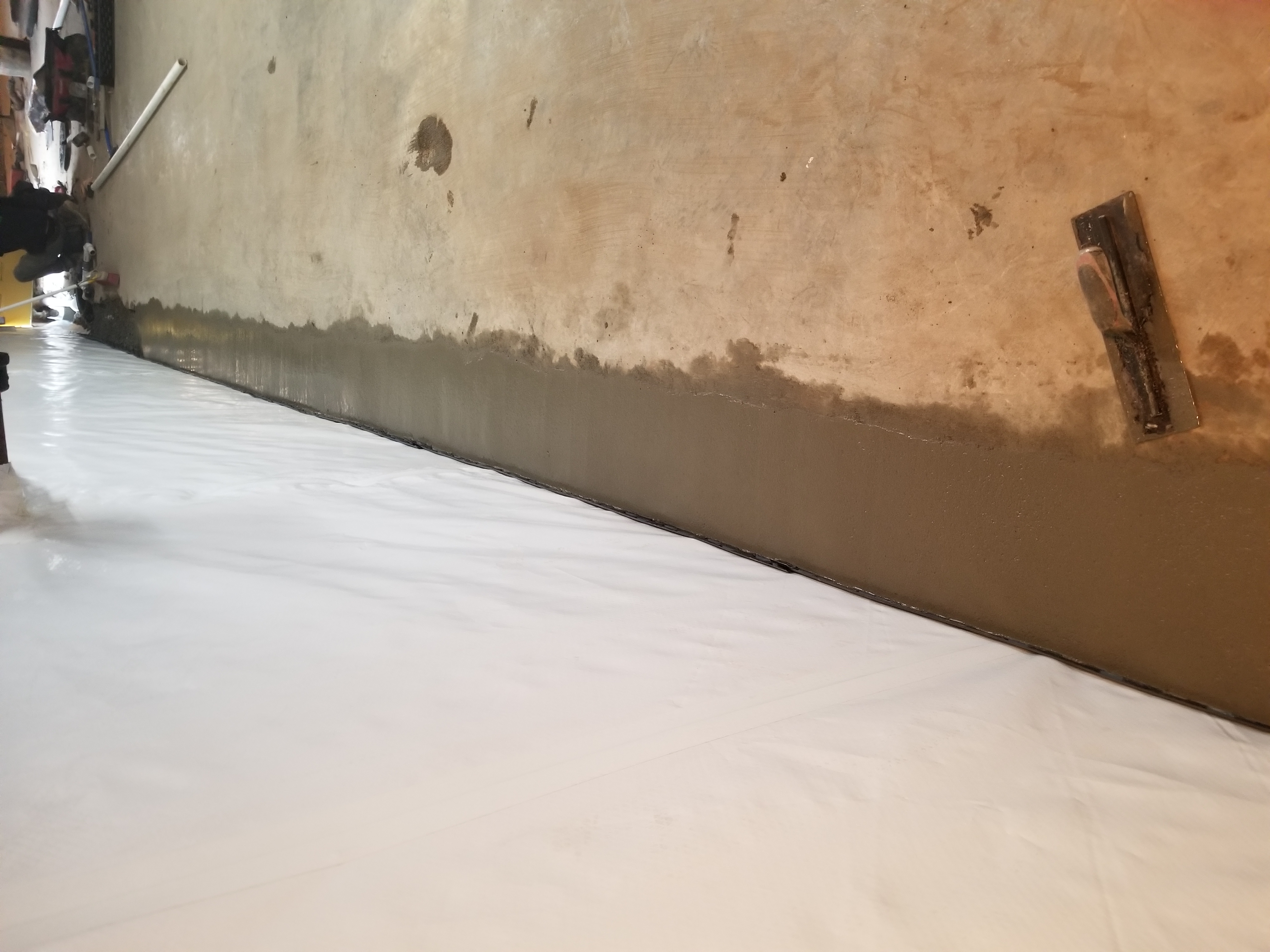 Floor liner sealed to wall vapor barrier — Blue Springs, MO