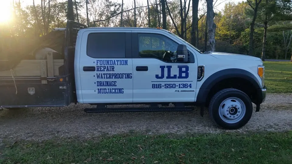 JLB Foundation Repair branded truck parked at residential job in Waukee