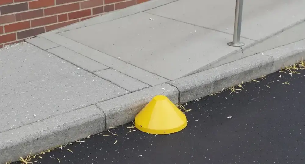 Concrete ramp curb with a detectable warning pad — ada ramps by JLB in Ames, Iowa