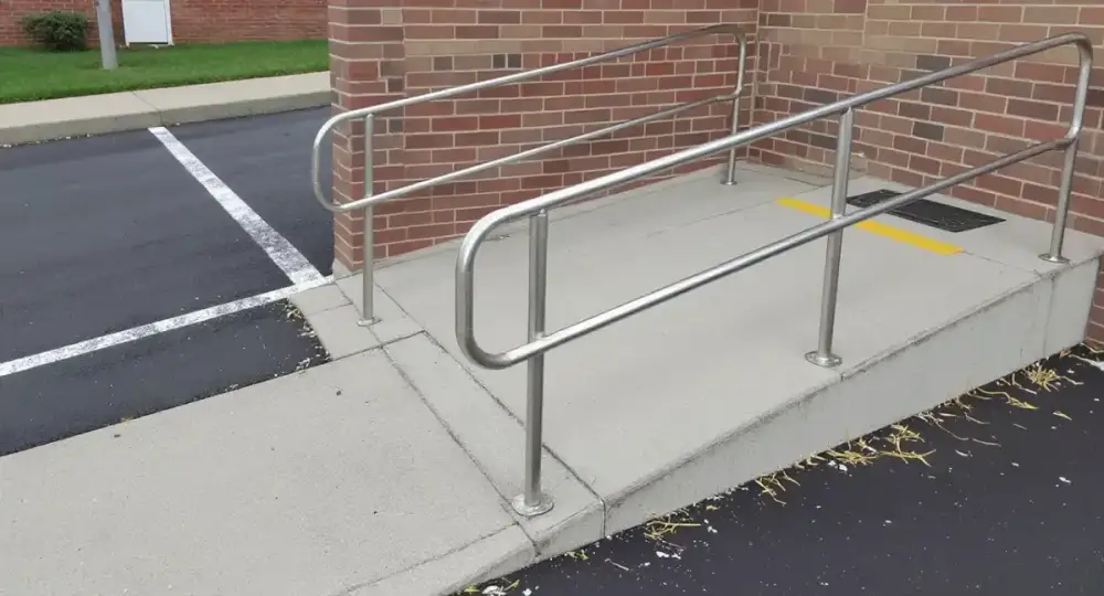 Concrete curb ramp with a detectable warning panel — ada ramps by JLB in Ames, Iowa