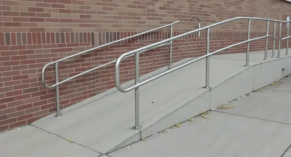 Long concrete accessibility ramp with a handrail — ada ramps by JLB in Ames, Iowa