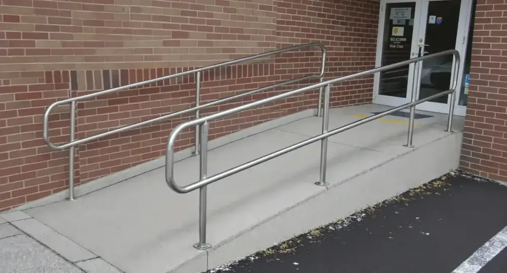 Switchback concrete accessibility ramp with railings — ada ramps by JLB in Ames, Iowa