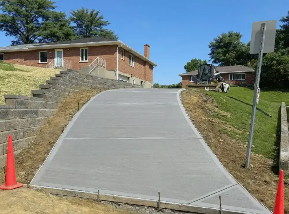 Sandstone-colored concrete driveway — driveways by JLB in Ankeny, Iowa