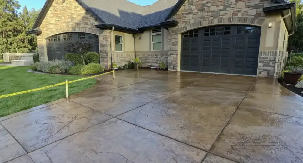 Stamped stone-pattern concrete driveway — driveways by JLB in Ankeny, Iowa