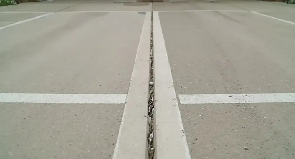Broom-finished concrete parking surface and stall line — parking lots by JLB in Ames, Iowa