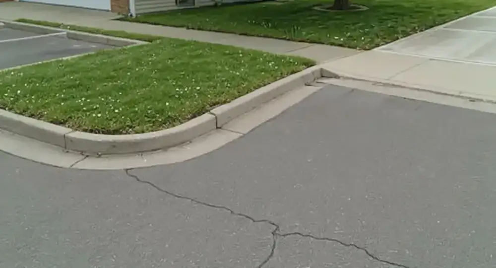Concrete parking lot meeting a sidewalk — parking lots by JLB in Ames, Iowa