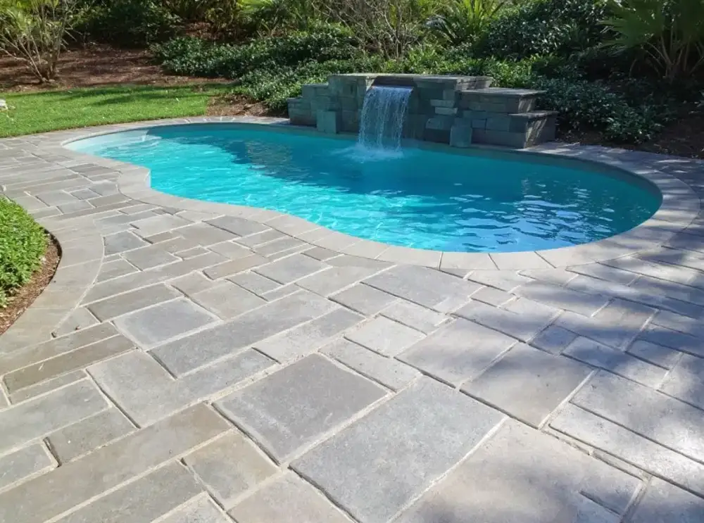 Slate-look concrete pool deck — pool decks by JLB in Ames, Iowa