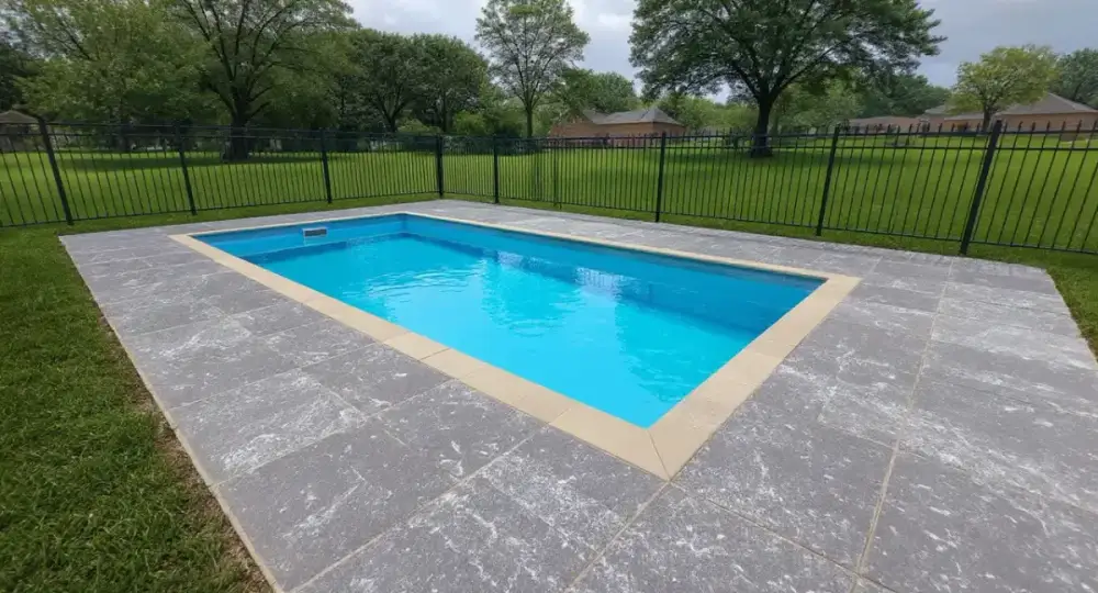 Slate-textured stamped concrete pool deck — pool decks by JLB in Ames, Iowa