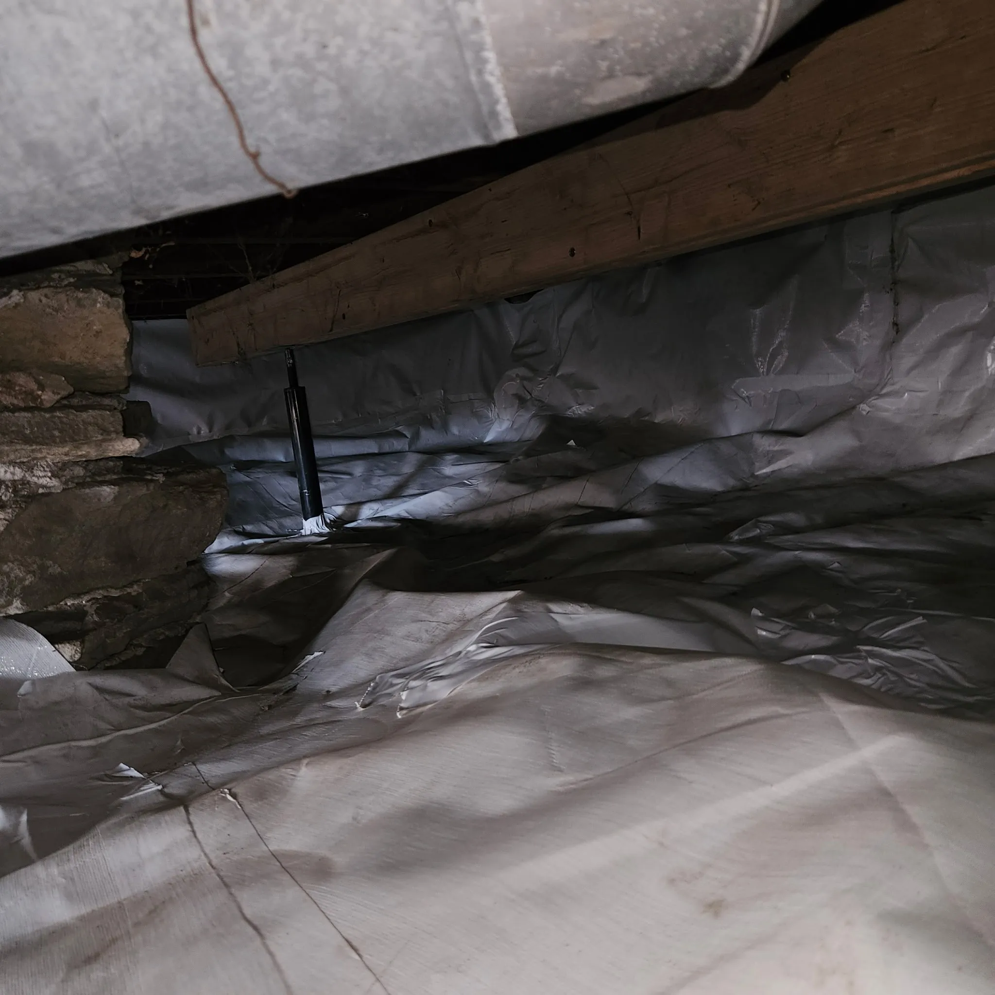 Vapor liner fully encapsulating crawlspace against moisture intrusion in Lawrence, KS