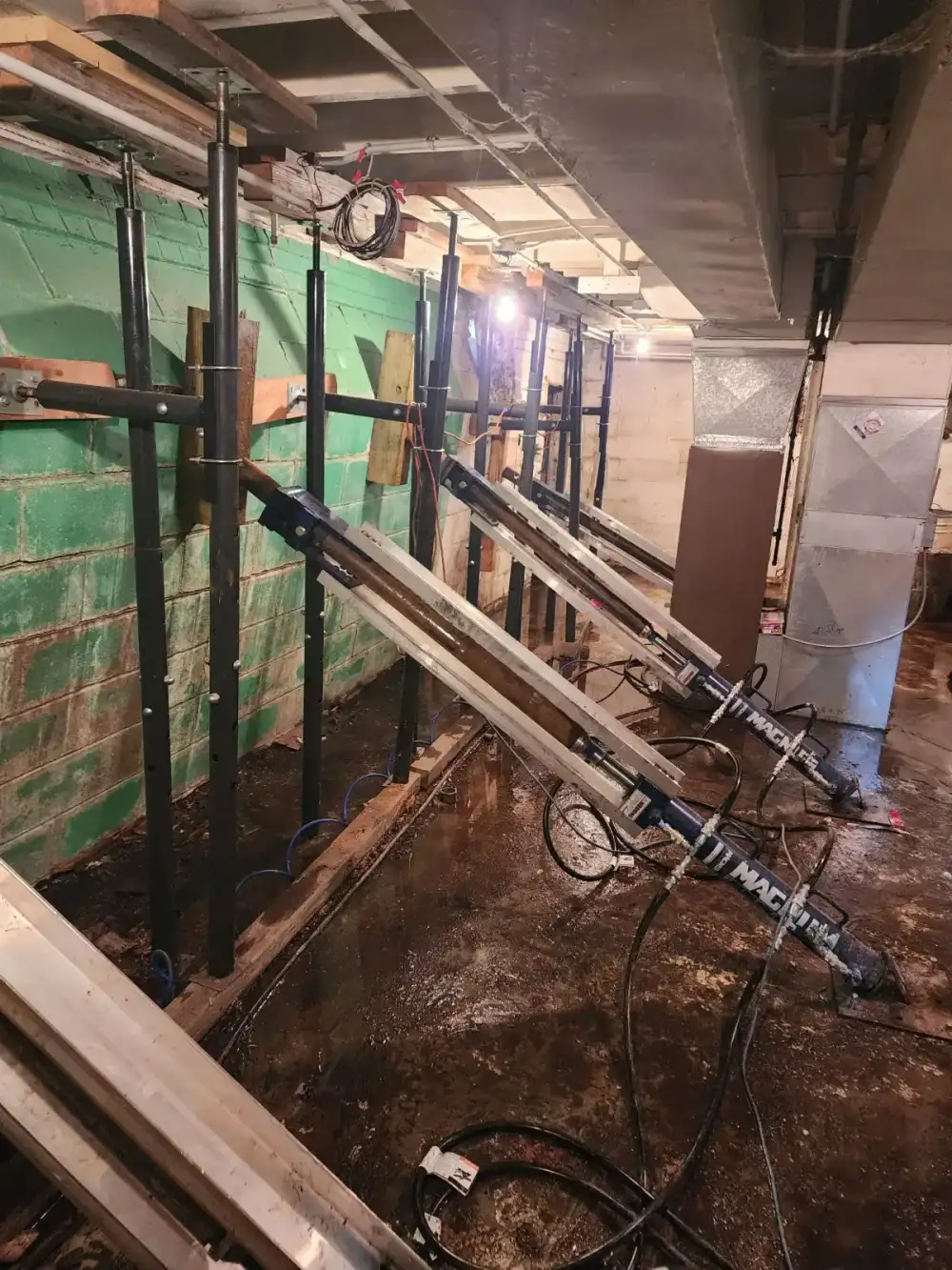 Steel wall braces installed in basement