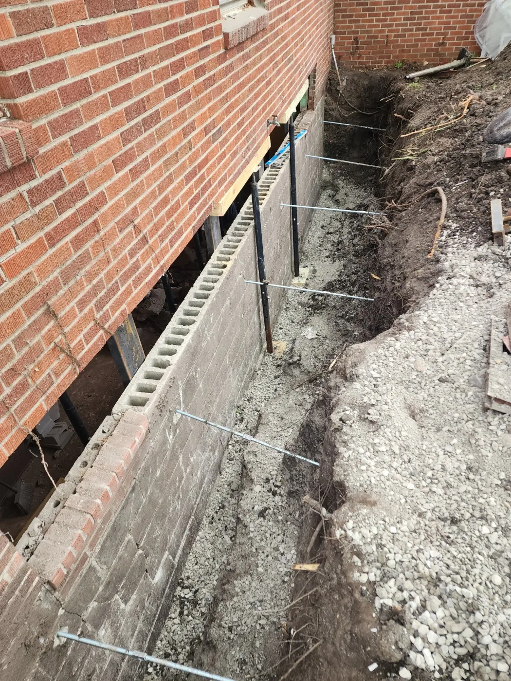 Steel-reinforced foundation wall replacement in Conrad, Iowa