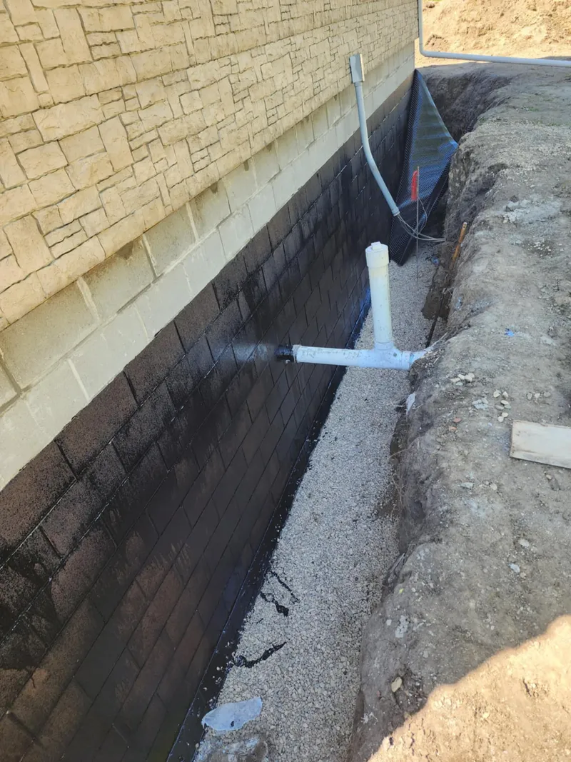 Steel push pier stabilization for a settling foundation in West Des Moines, IA