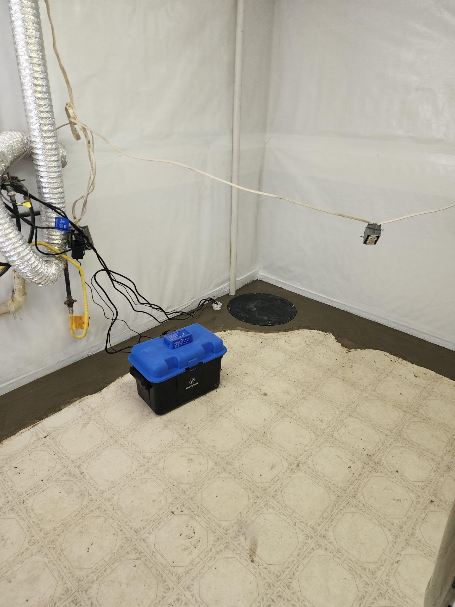 Sump pump and battery backup in sealed space