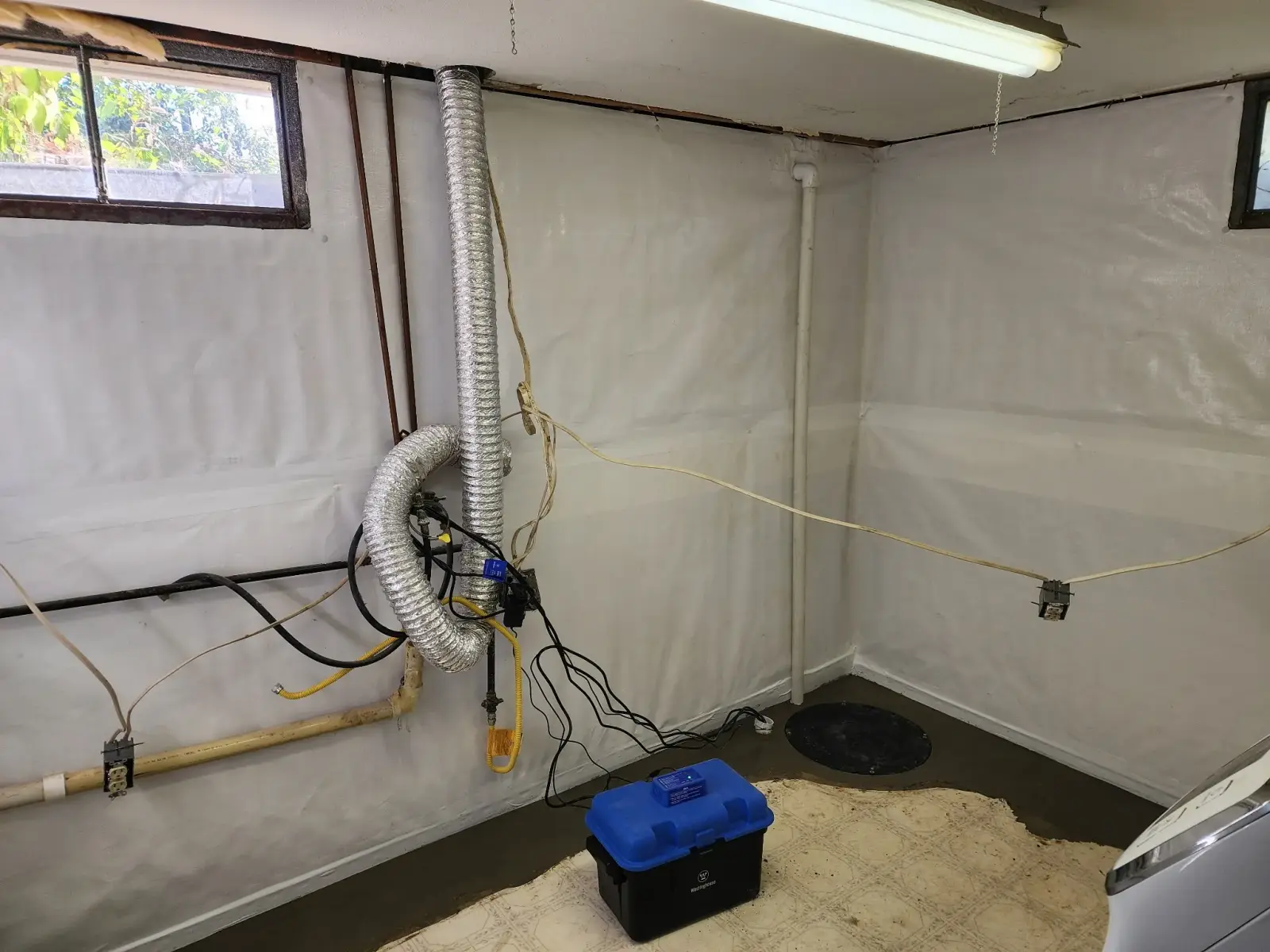 Basement liner and sump pump system installed