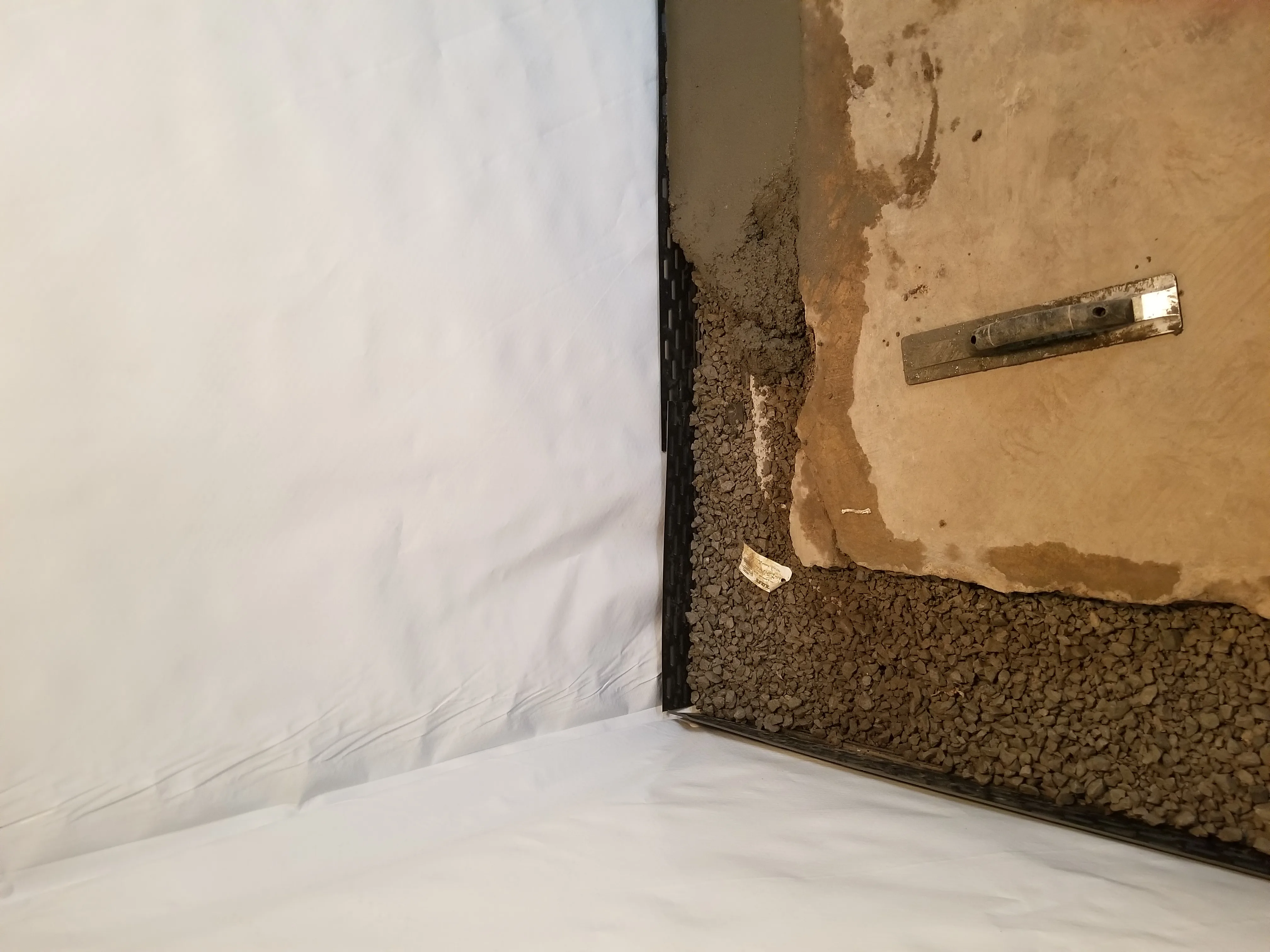 Old 1800s basement in Manson upgraded with modern interior drain tile — JLB Waterproofing
